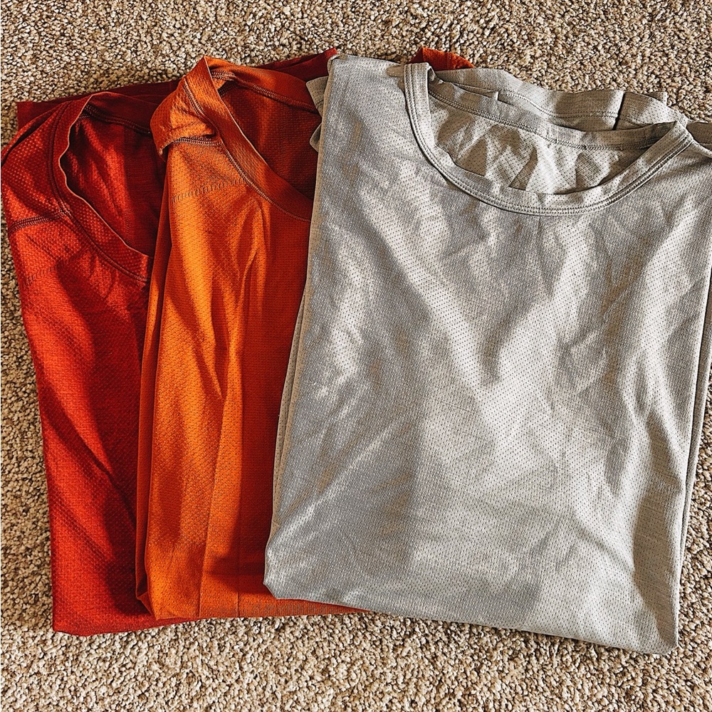 3 men’s large athletic workout shirts.